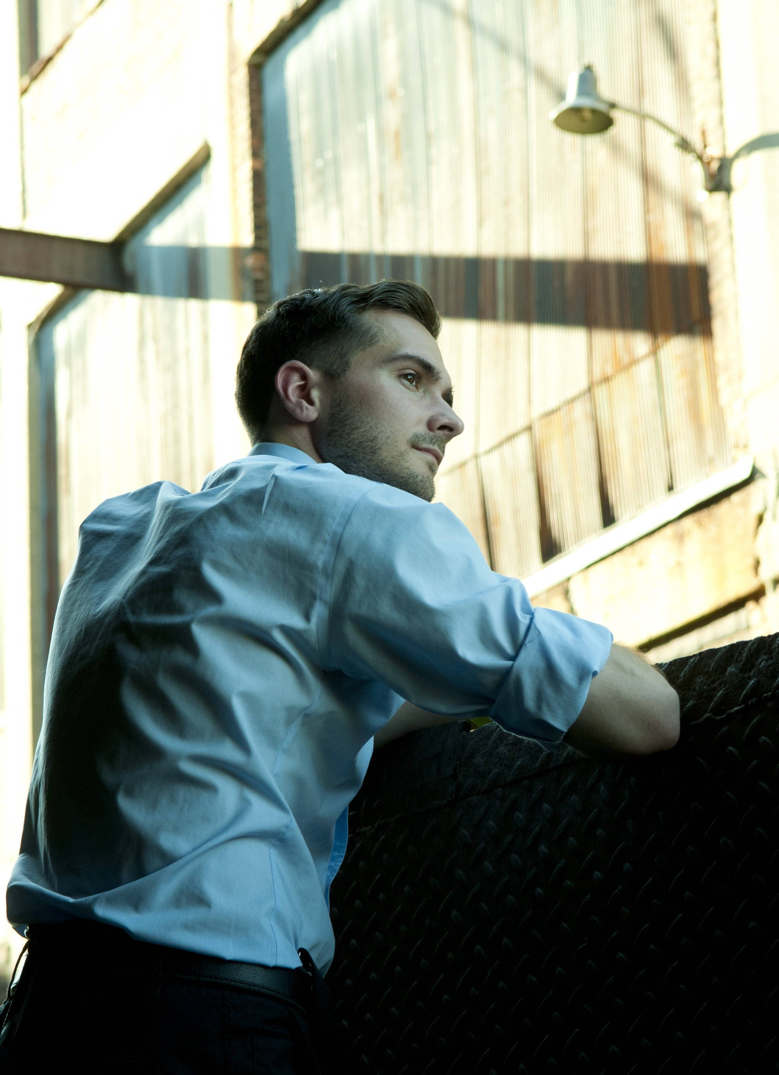 Tyler Jameson with a rustic background.